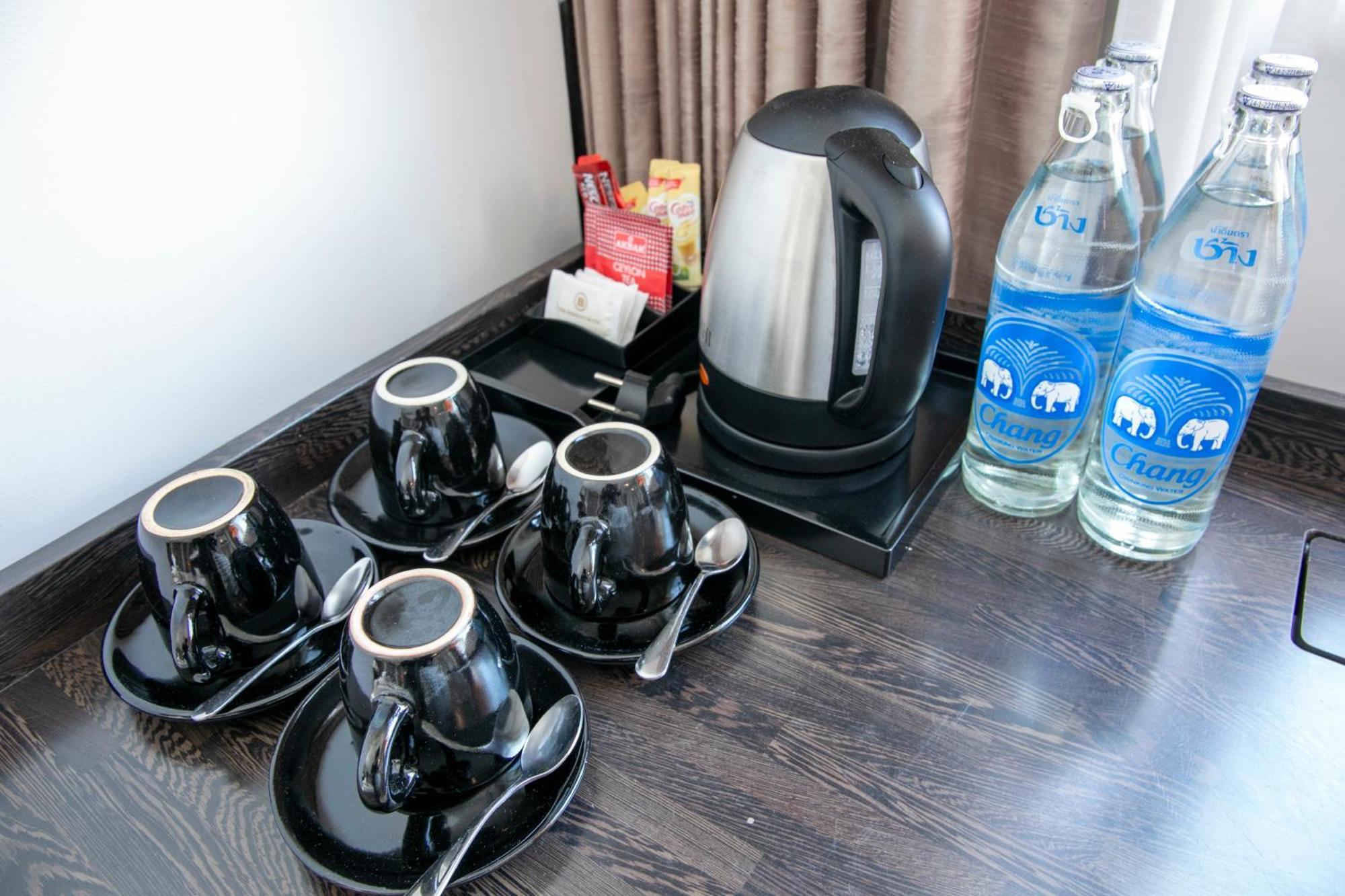 The Berkeley Hotel Pratunam Bangkok Exterior photo A kettle with two bottles of water